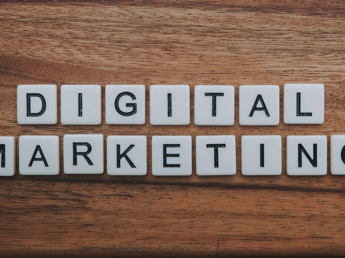 Wooden tiles spelling out 'digital marketing' on a rustic wood surface, representing GiveTurn's digital marketing service